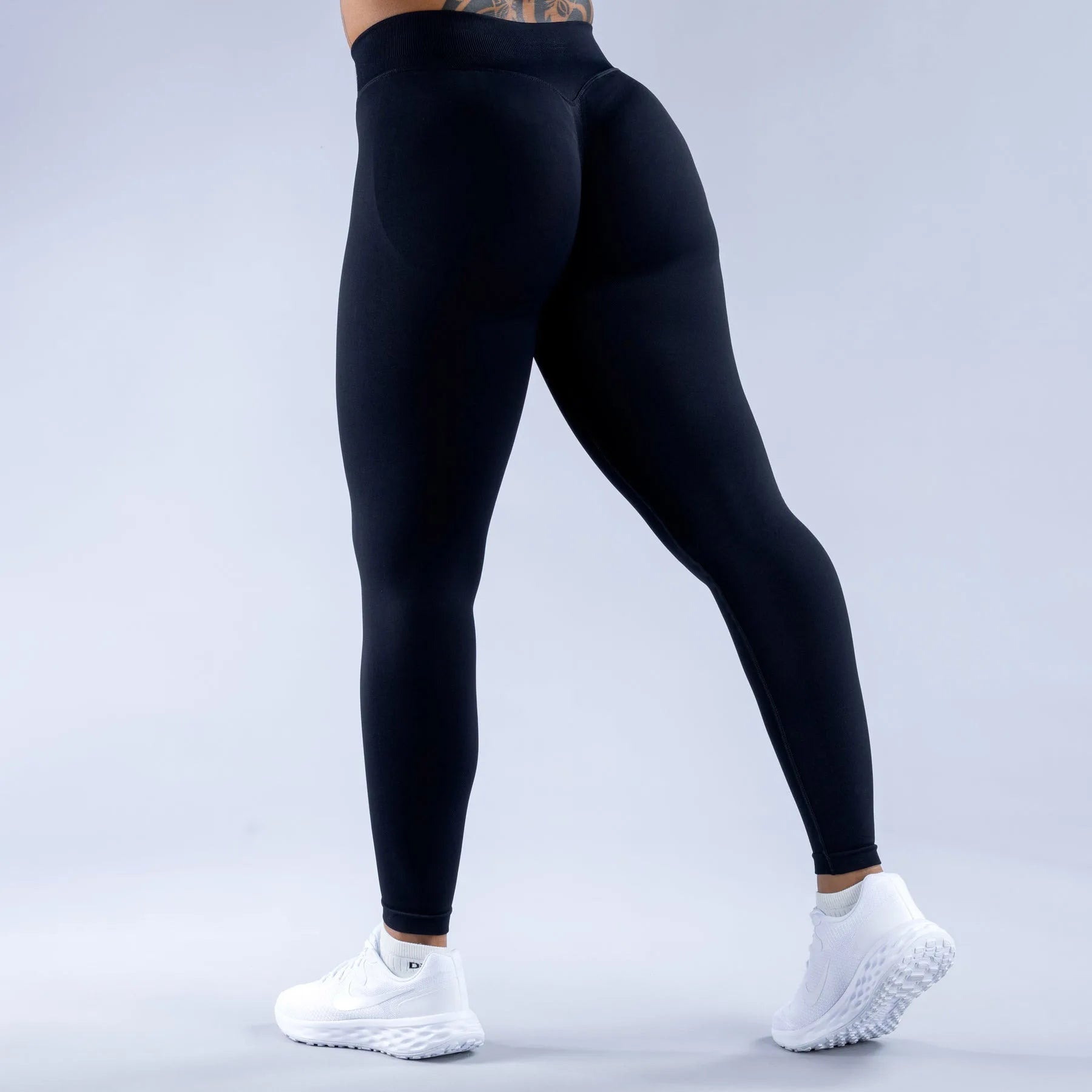 Black high waist seamless impact gym and yoga leggings with Scrunch Fit to shape and define the booty pump