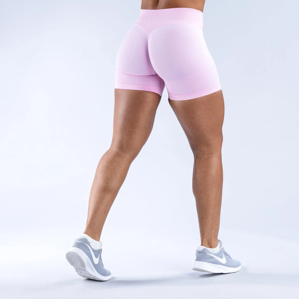 High waist seamless pink colored impact gym shorts with Scrunch Fit to shape and define the booty pump