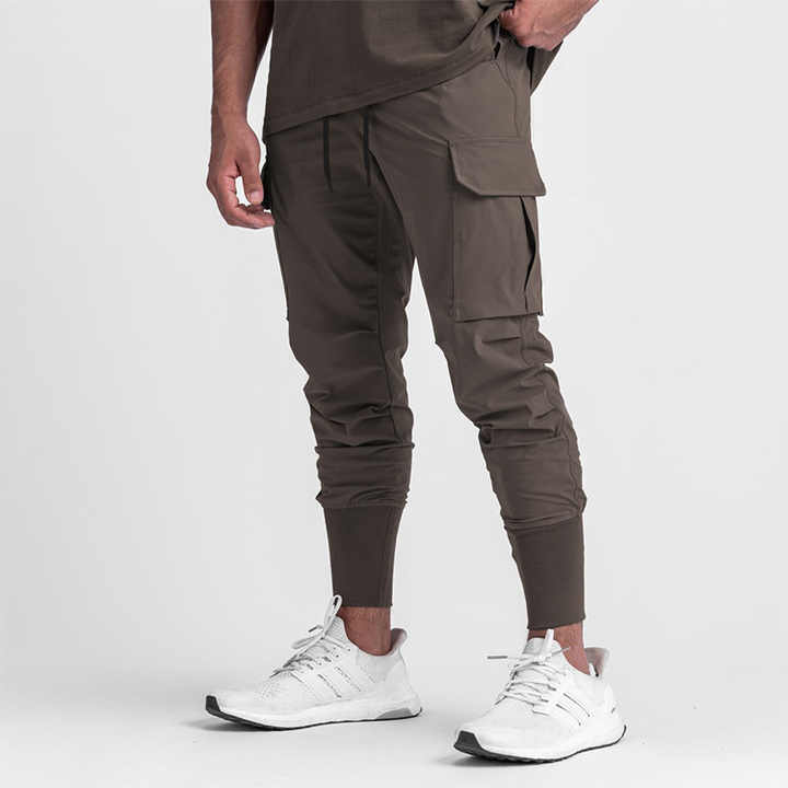 Men's brown colored gym cargo joggers designed for comfort and performance during workouts