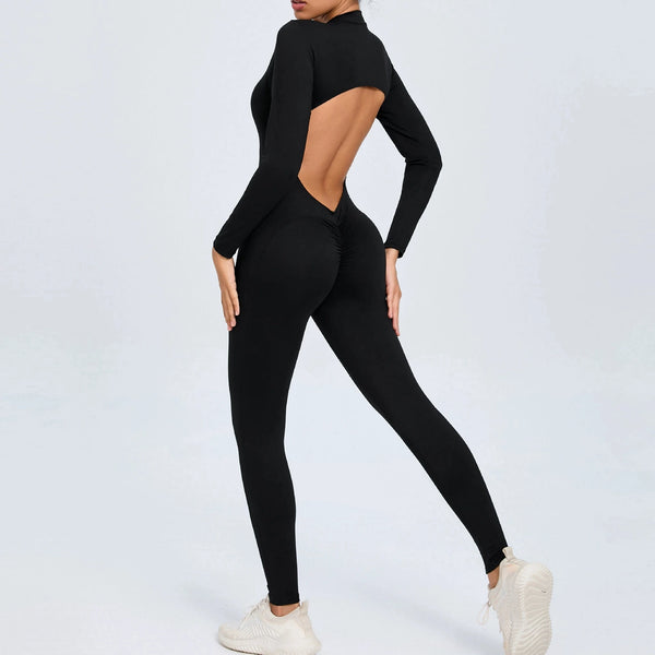 Black backless long sleeve sports jumpsuit with front zipper designed for extreme comfort and confidence in the gym by allowing you to show off that pumped back