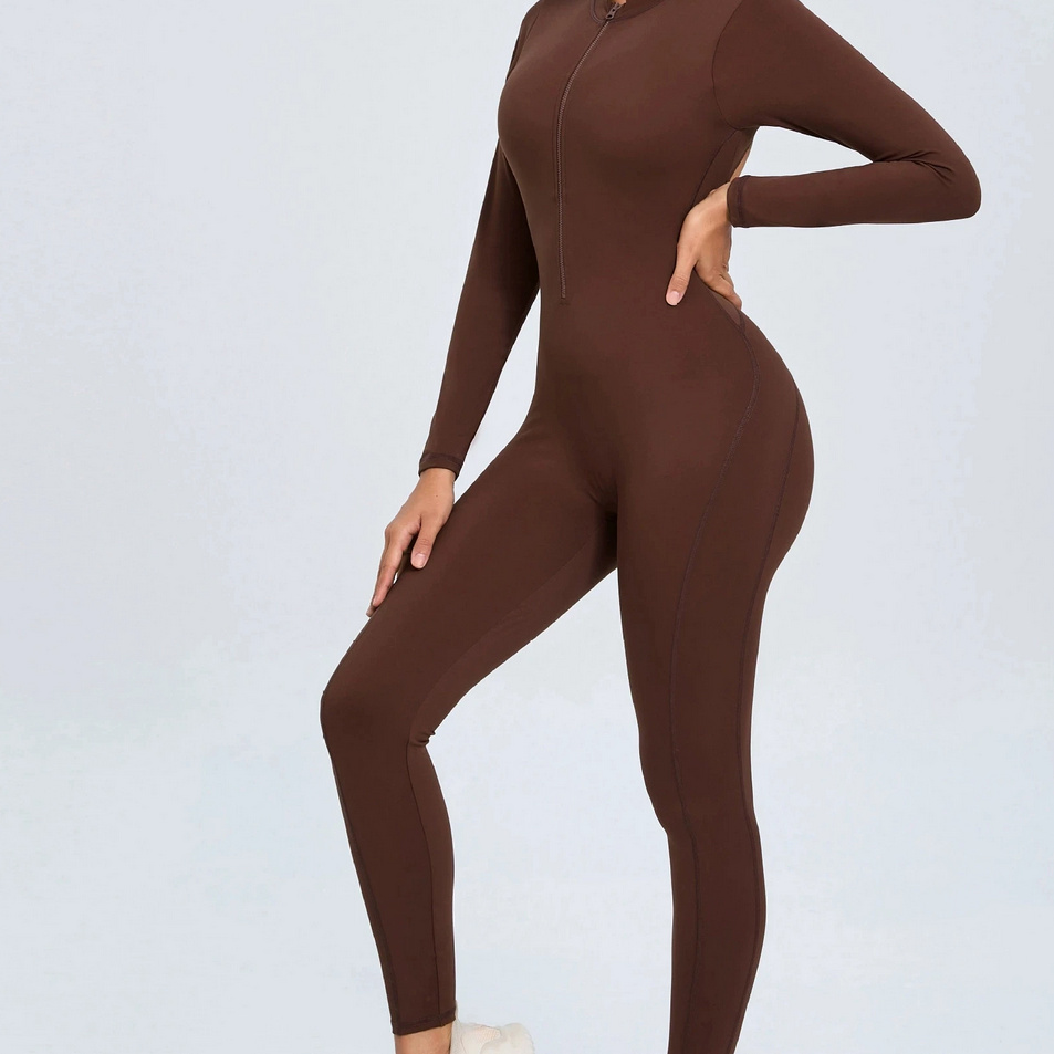 Brown backless long sleeve sports jumpsuit with front zipper designed for extreme comfort and confidence in the gym by allowing you to show off that pumped back