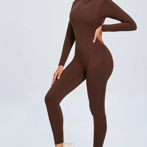 Brown backless long sleeve sports jumpsuit with front zipper designed for extreme comfort and confidence in the gym by allowing you to show off that pumped back