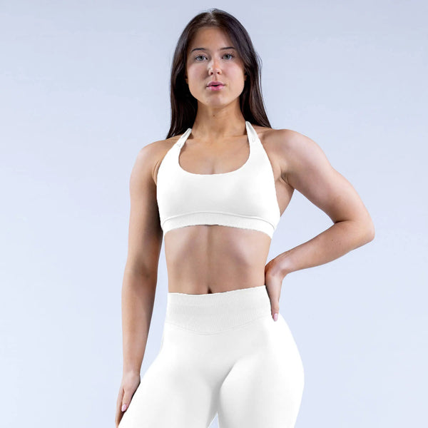 White impact sports bra designed to comfortably hug and hold, its backless design allows you to show of that vicious lat pump during upper body training days